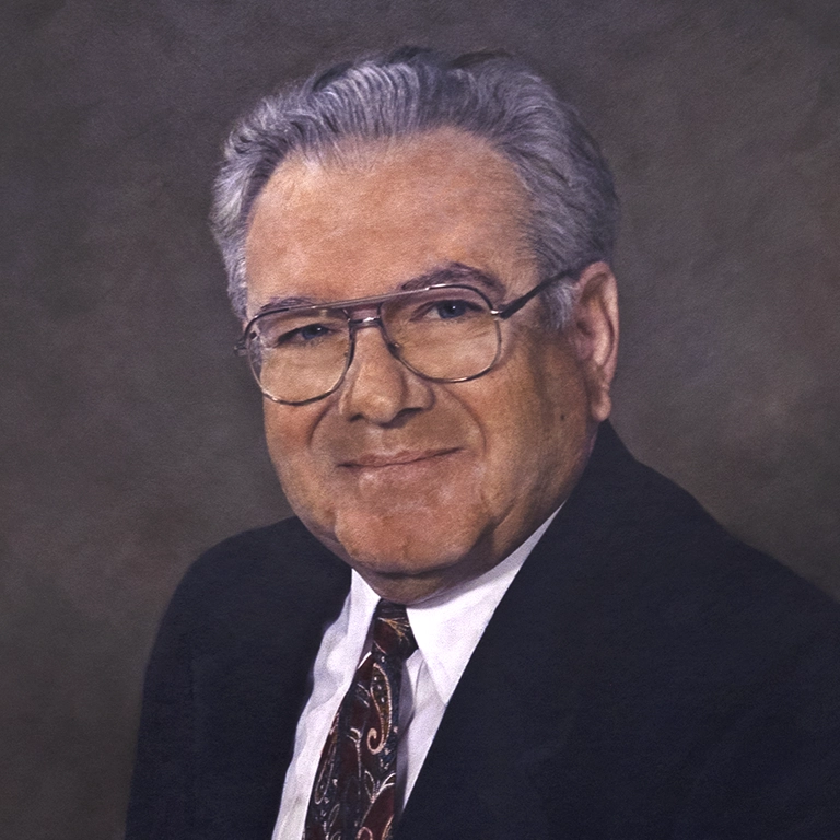 Painting of Leon Rand wearing a suit and glasses and smiling