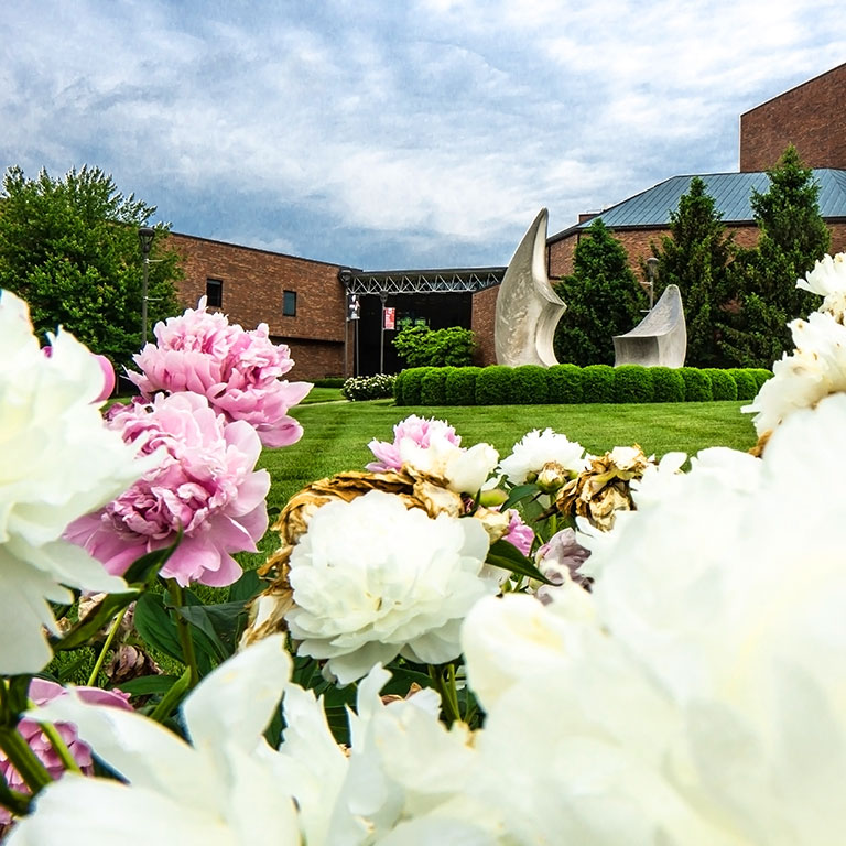 The Ogle Center at IU Southeast in the spring, surrounded by flowers
